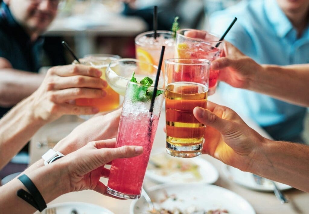 A groups of people clinking glasses